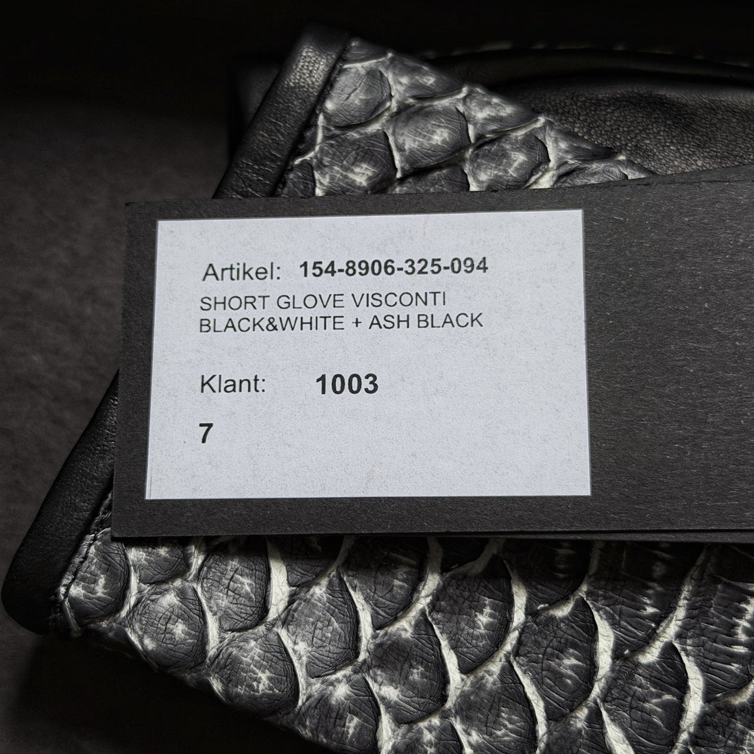 Haider Ackermann glove article tag showing style code and size