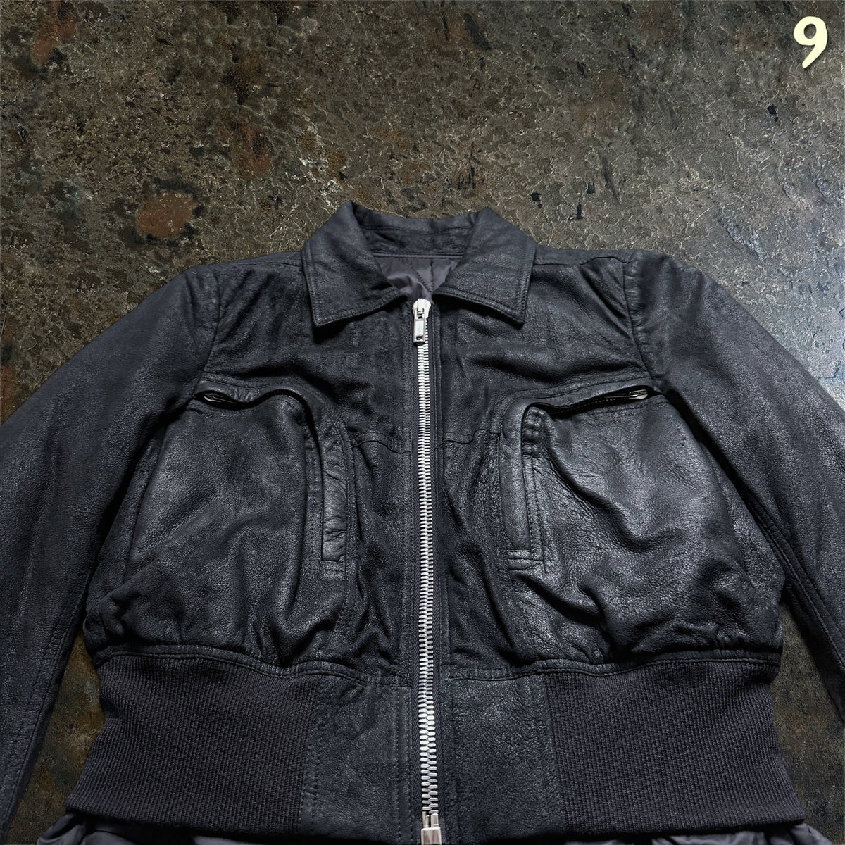 Rick Owens Larry coat, angled detail of the chest pockets and ribbed waistband
