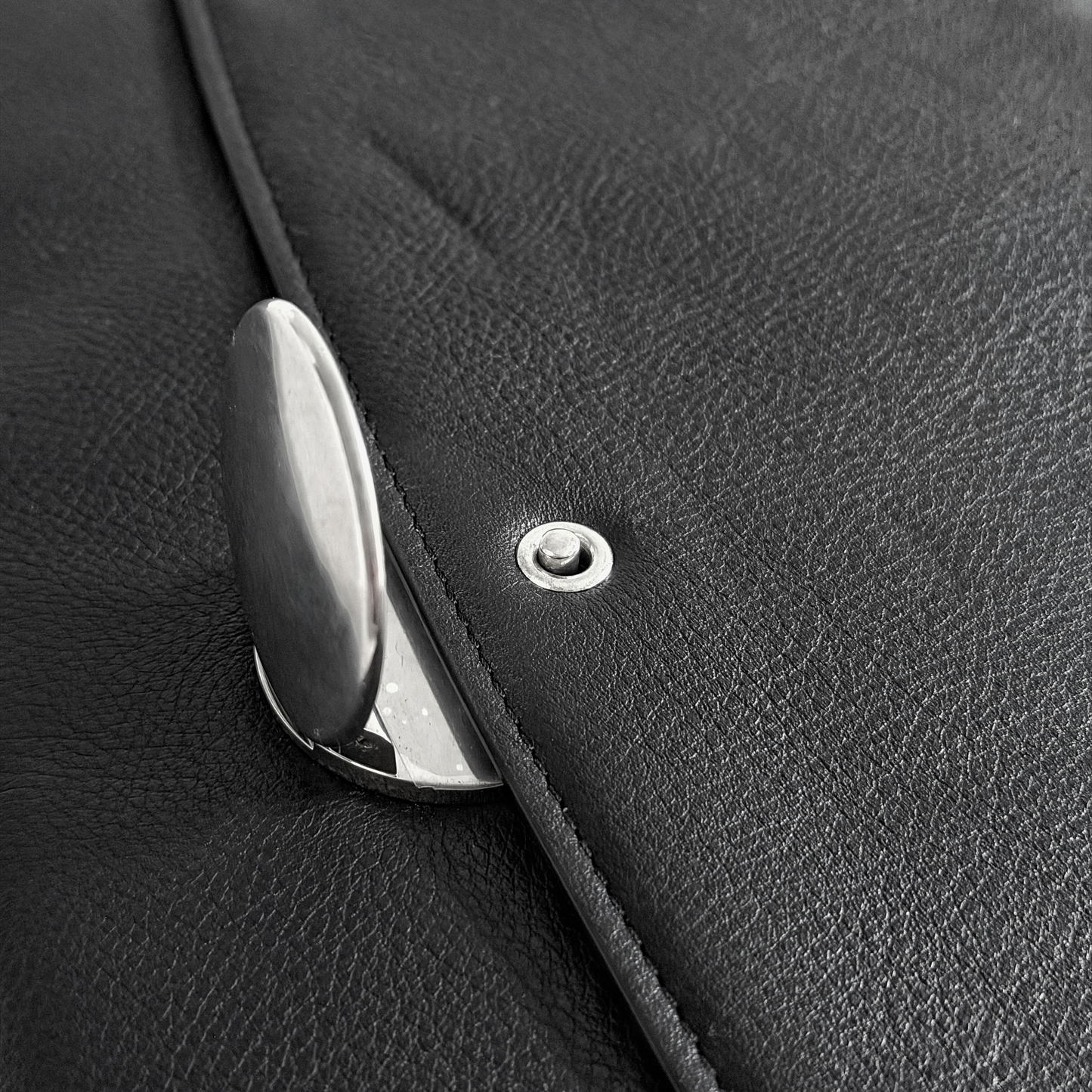 Silver closure and press-stud detail on Ann Demeulemeester leather bag