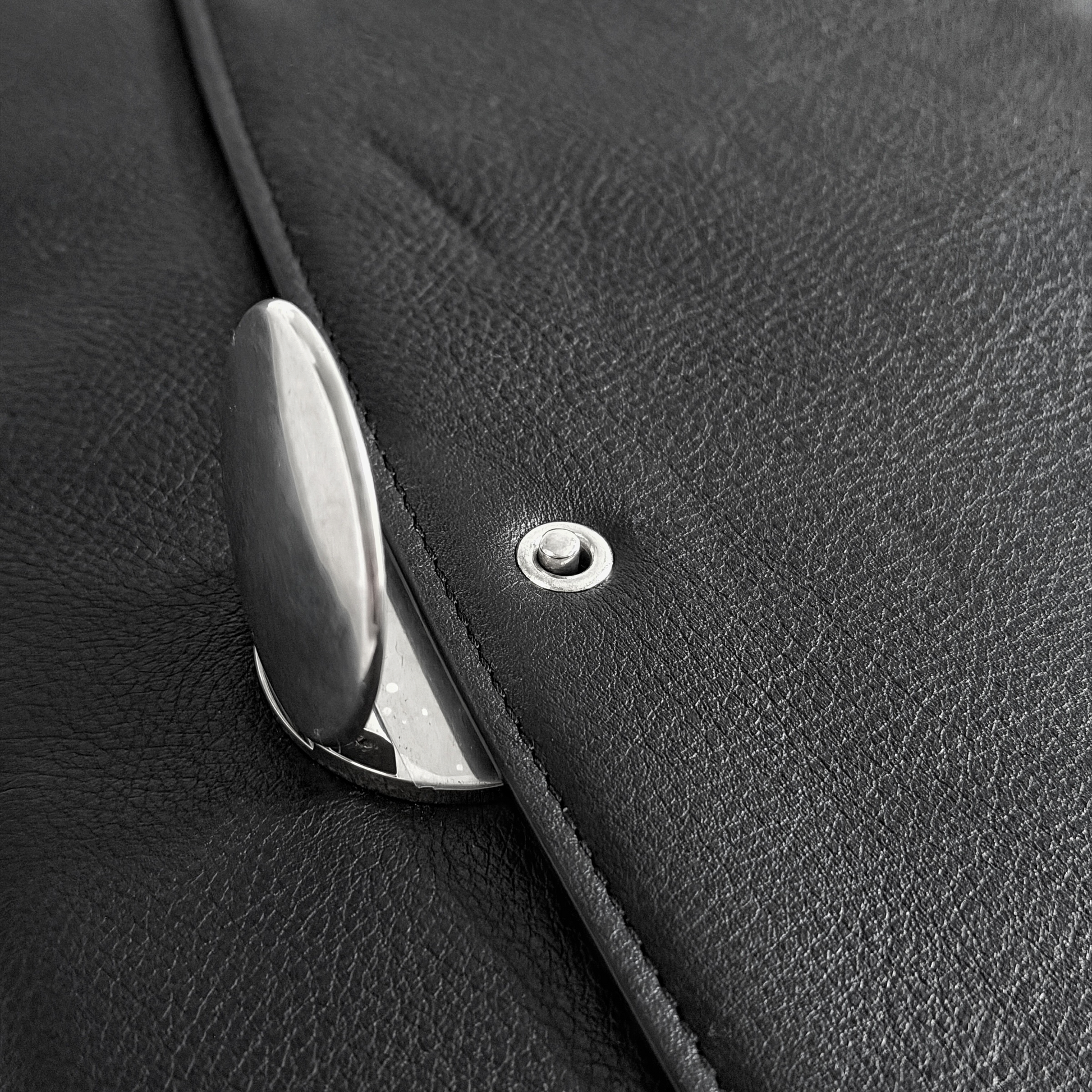 Silver closure and press-stud detail on Ann Demeulemeester leather bag