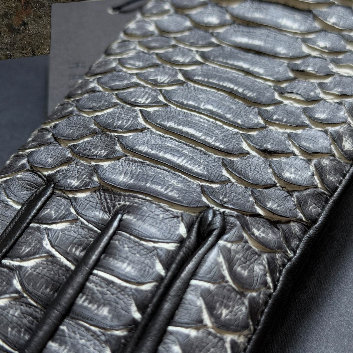 Haider Ackermann Python leather gloves close-up of grey black python scales